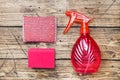 Bottles with detergents, brushes and sponges on wooden background. Colorful cleaning products. Home cleaning concept. Top view, Royalty Free Stock Photo