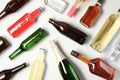 Bottles with different alcoholic drinks on light background Royalty Free Stock Photo