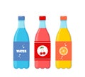 Bottles of different fizzy drinks. Soda, water, juice in plastic bottles, beverages with different flavors isolated on white Royalty Free Stock Photo