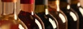 Bottles of different wines, closeup. Banner design Royalty Free Stock Photo