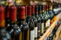 Bottles of different wines, closeup. Expensive collection Royalty Free Stock Photo