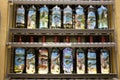 Display of bottles decorated with views of Bellagio outside a souvenirs shop. Lake Como, Italy.