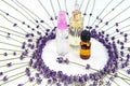 Bottles of essential lavender oil and spray with fresh lavender flowers on white background, organic cosmetic products Royalty Free Stock Photo