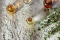 Bottles of essential oil with fresh thyme twigs Royalty Free Stock Photo