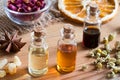 Bottles of essential oil with herbs and spices Royalty Free Stock Photo