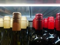 Bottles of expensive packaged red wine are on sale at a liquor store
