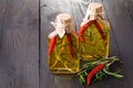 Bottles of extra virgin olive oil with aromatic herbs Royalty Free Stock Photo