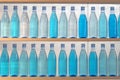 Bottles filled with water, standing on the shelf Royalty Free Stock Photo