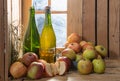 Bottles and glass of cider with apples Royalty Free Stock Photo