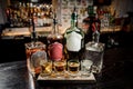 Bottles and glasses with alcoholic drinks on the bar counter Royalty Free Stock Photo