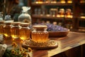 Bottles of herbal tincture with dried chamomile calendula lavender yarrow mint and other herbs in the background Royalty Free Stock Photo