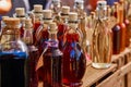 Bottles of homemade liqueur and schnapps on a wooden shelf Royalty Free Stock Photo