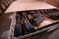 bottles made of dark glass on a shelf in the cellar of the winery. Rum, whiskey or old wine of refined taste Royalty Free Stock Photo