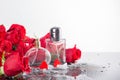 Bottles of male and female perfume, red roses, decorative hearts. Cosmetics Presentation. Royalty Free Stock Photo