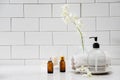 Bottles with massage essentials oils, towels and zen stones. Royalty Free Stock Photo