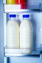 Bottles of milk in the fridge