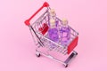 Bottles in mini shopping cart