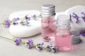 Bottles with natural lavender essential oil on light background Royalty Free Stock Photo