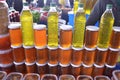 Bottles of olive oil and glass bottles with honey on a stand and stall in bazaar turkey antalya