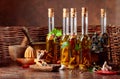 Bottles of olive oil with various herbs and spices Royalty Free Stock Photo