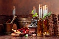 Bottles of olive oil with various spices and vintage cooking utensils Royalty Free Stock Photo
