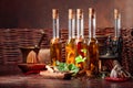 Bottles of olive oil with various spices and vintage cooking utensils Royalty Free Stock Photo