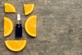 Bottles with orange fruit essential oil on wooden background. alternative medicine top view with copy space Royalty Free Stock Photo