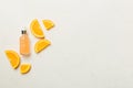 Bottles with orange fruit essential oil on wooden background. alternative medicine top view with copy space Royalty Free Stock Photo