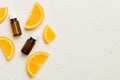 Bottles with orange fruit essential oil on wooden background. alternative medicine top view with copy space Royalty Free Stock Photo