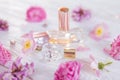 Bottles of perfume with flowers Royalty Free Stock Photo