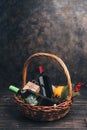 Bottles of red and white wine in Christmas gift basket