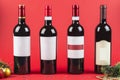 Bottles of red and white wine on a dark Burgundy background close-up. New year and Christmas Royalty Free Stock Photo