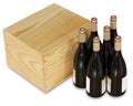 6 bottles of red wine bottles next to a closed wooden box isolated on white background Royalty Free Stock Photo