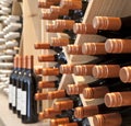 Bottles of red wine for sale on racks in winery shop tasting room, Nelson, South Island, New Zealand. Royalty Free Stock Photo