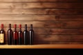 Bottles of red wine on a wooden shelf. Copy space for winery Royalty Free Stock Photo