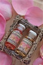 Bottles of Rose Essence with Petals Royalty Free Stock Photo