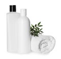 Bottles of shampoo and terry towel on white background Royalty Free Stock Photo