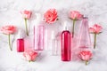 Bottles skincare lotion serum medical rose flowers. organic natural cosmetic