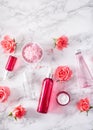 Bottles skincare lotion serum medical rose flowers. organic natural cosmetic