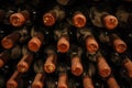 bottles stacked up in old wine cellar Royalty Free Stock Photo