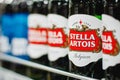 Bottles of Stella Artois Belgian beer on the supermarket shelf Royalty Free Stock Photo