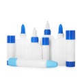 Bottles and sticks of glue on white background Royalty Free Stock Photo