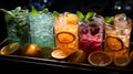 Bottles with tasty drinks in bucket with ice cubes Royalty Free Stock Photo