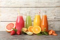 Bottles with tasty juices and ingredients Royalty Free Stock Photo