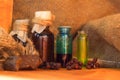 Bottles of tincture or potion or oil herbs, on wooden table. Herbal medicine. Retro styled