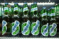 MINSK, BELARUS - December 13, 2019: Bottles of Tuborg beer in refrigerator of supermarket close up.