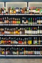 Bottles with various alcoholic beverages on display in a store Royalty Free Stock Photo