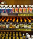 Bottles with various chili oil on shelves of the Asian grocery store