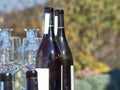 Bottles of wine and glasses with the Langhe countryside in the b Royalty Free Stock Photo