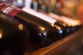 Bottles of wine in a row in a wine store close-up Royalty Free Stock Photo